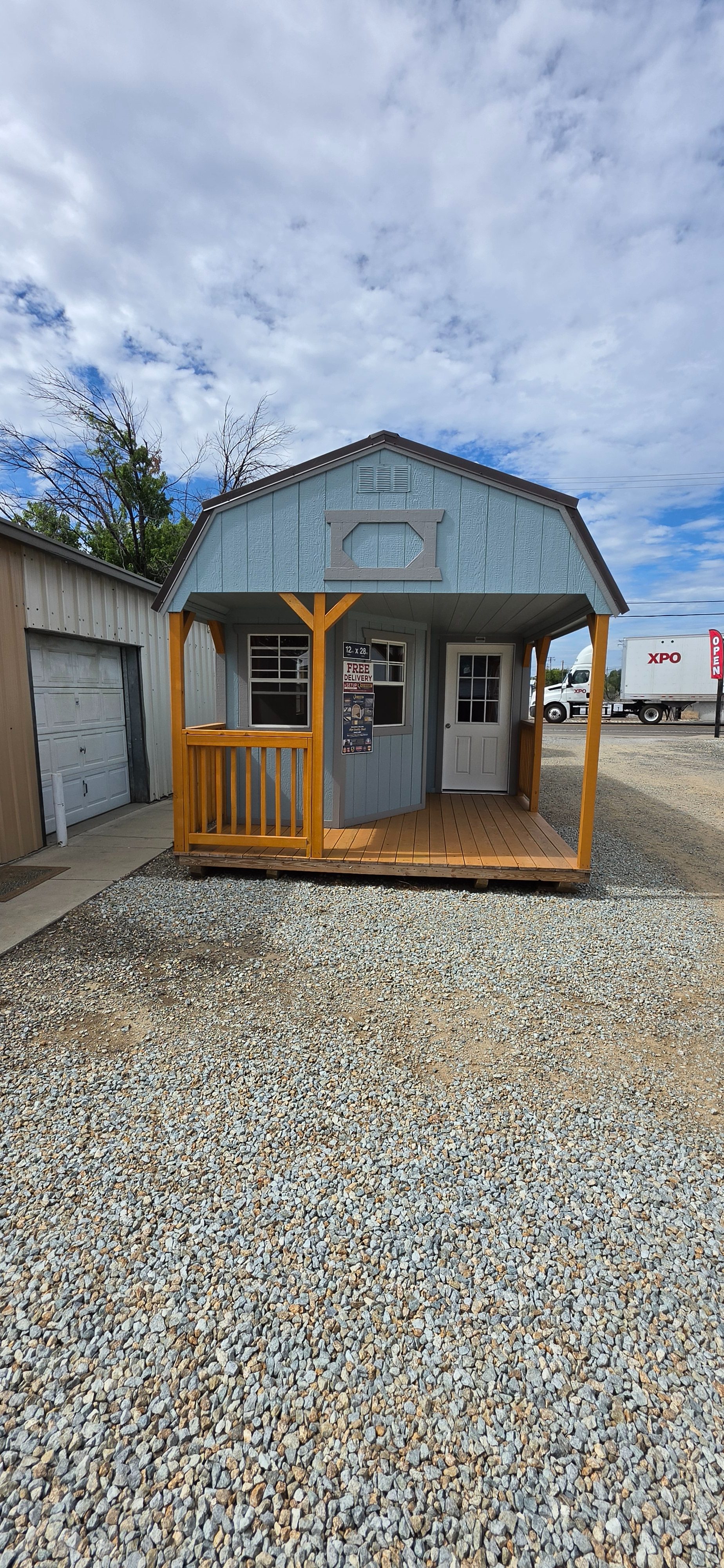 Old Hickory lofted barn cabin with front porch on the lot in Redding