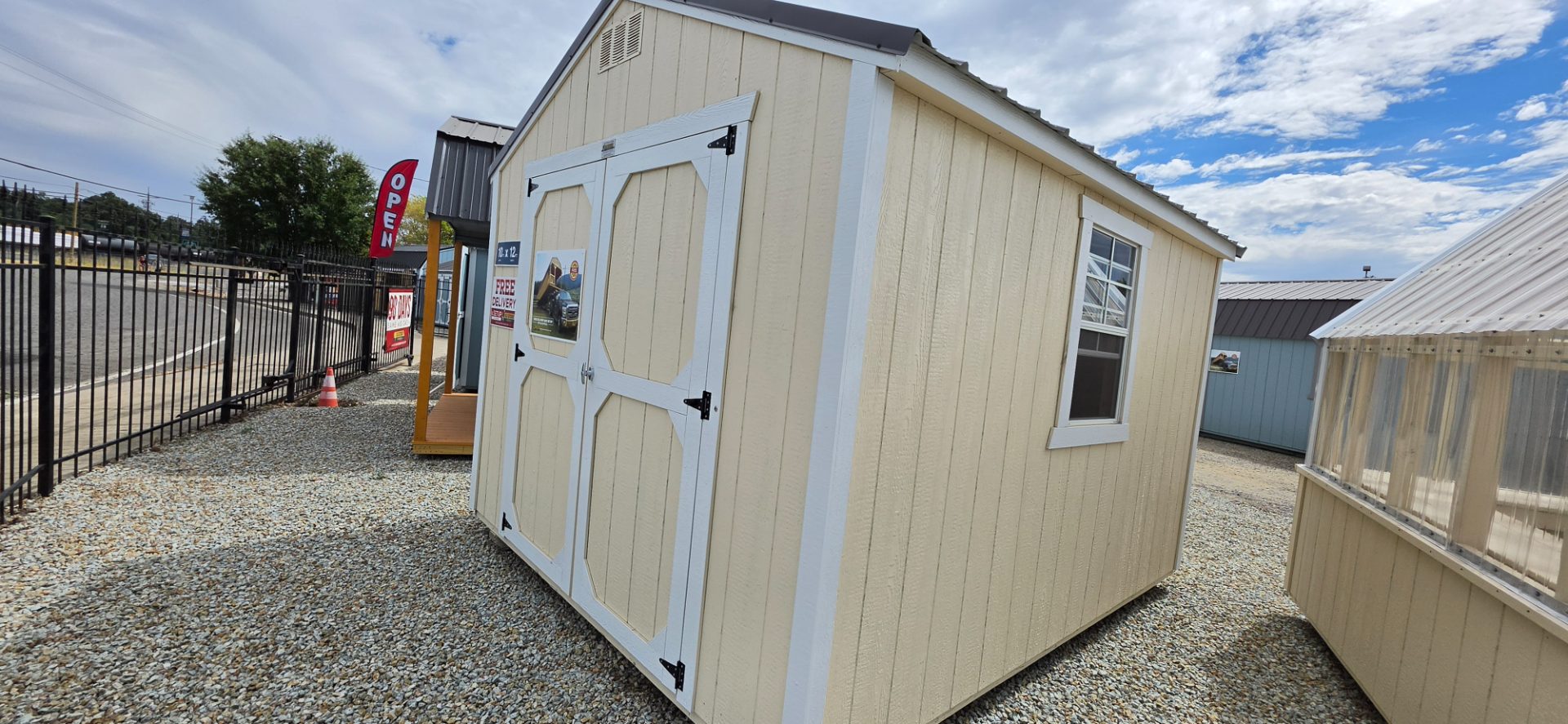 Old Hickory utility shed, beige with white trim